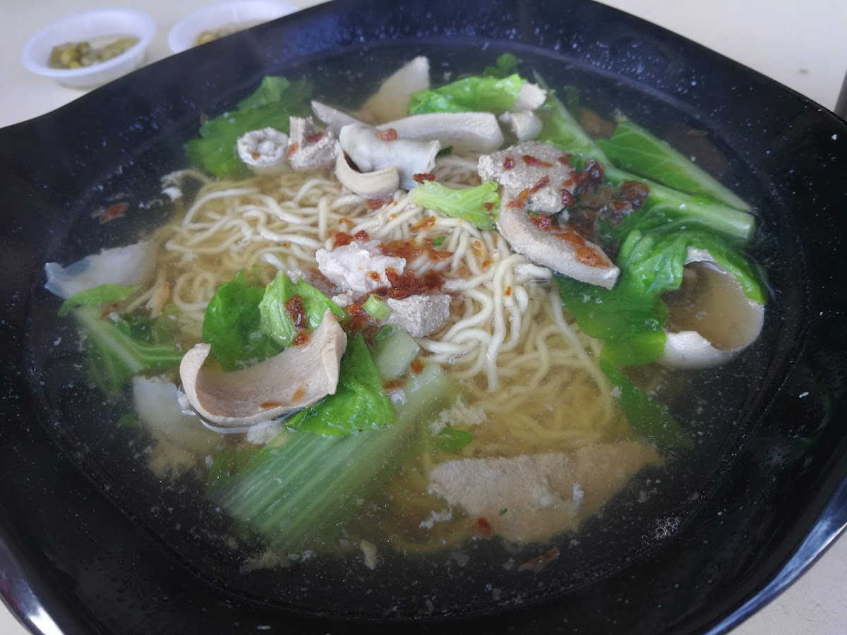 Noodle dish in black bowl at Xiang Xiang Food Court Piasau Miri